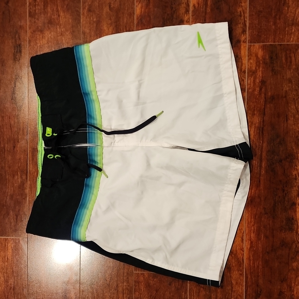 Speedo swim shorts. Pockets side and back. Lined. Tie and Velcro closure